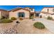 Charming single-Gathering home with a low maintenance desert-style front yard and a long private driveway at 18060 W Rimrock St, Surprise, AZ 85388