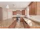 Spacious kitchen featuring granite countertops and stainless steel appliances at 18060 W Rimrock St, Surprise, AZ 85388