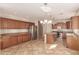 Spacious kitchen with granite countertops, stainless steel appliances, and kitchen island at 18060 W Rimrock St, Surprise, AZ 85388