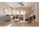 Staged living room with large windows that let in lots of natural light at 18060 W Rimrock St, Surprise, AZ 85388