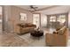 Cozy living room featuring neutral tones, comfortable seating, and an adjacent dining area at 18060 W Rimrock St, Surprise, AZ 85388
