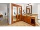 Beautiful bathroom featuring dual vanities, a soaking tub, and a framed mirror at 18681 N 93Rd St, Scottsdale, AZ 85255