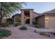 Stunning front entrance featuring a double door and well-maintained desert landscaping at 18681 N 93Rd St, Scottsdale, AZ 85255