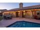 A beautiful pool with a covered patio area, perfect for outdoor entertaining and relaxation at 18681 N 93Rd St, Scottsdale, AZ 85255