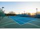 An outdoor tennis court is available for play at sunset at 18681 N 93Rd St, Scottsdale, AZ 85255