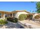 Charming single-story home featuring desert landscaping, mature shrubs, and a welcoming walkway at 18826 N 134Th Ave, Sun City West, AZ 85375