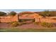 Regency at Quail Creek entrance with stone accents and manicured landscaping at 19235 E Peartree Ln, Queen Creek, AZ 85142