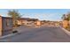 Gated entrance to the Regency at Quail Creek with a keypad and desert landscaping at 19235 E Peartree Ln, Queen Creek, AZ 85142