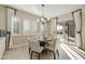 Breakfast nook with natural light, slider to outdoor space and view into kitchen at 19235 E Peartree Ln, Queen Creek, AZ 85142