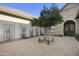 Exterior front yard features a mature olive tree at 19235 E Peartree Ln, Queen Creek, AZ 85142