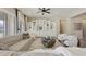 Bright living room featuring a comfortable sofa, elegant built-in shelving, and stylish decor at 19235 E Peartree Ln, Queen Creek, AZ 85142