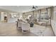 Open-concept living room with a comfortable seating arrangement and view of the kitchen at 19235 E Peartree Ln, Queen Creek, AZ 85142