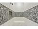Modern tiled shower featuring a bench seat and recessed shelving at 19235 E Peartree Ln, Queen Creek, AZ 85142