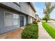 Townhouse exterior with green bushes, well-maintained landscaping, and covered front entrance at 19601 N 7Th St # 1009, Phoenix, AZ 85024