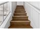 Staircase with wood treads and white railing at 19601 N 7Th St # 1009, Phoenix, AZ 85024