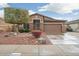 Charming single-story home with desert landscaping and a two-car garage at 20529 N 94Th Ln, Peoria, AZ 85382