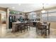 Modern kitchen with black appliances, an island, and lots of counter space at 20529 N 94Th Ln, Peoria, AZ 85382