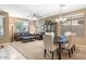 Bright living room with carpet floors, a chandelier, and lots of natural light at 20529 N 94Th Ln, Peoria, AZ 85382