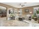 Living room featuring neutral tones, ample seating, and a view into the kitchen at 20529 N 94Th Ln, Peoria, AZ 85382