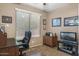 Home office space featuring built-in desk and natural light from the window at 20529 N 94Th Ln, Peoria, AZ 85382
