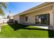 Backyard featuring a covered patio and low-maintenance artificial grass at 2132 N Holguin Way, Chandler, AZ 85225