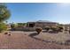 Lovely home featuring a covered patio, low-maintenance landscaping, and a neutral color palette at 21730 N Black Bear Lodge Dr, Surprise, AZ 85387