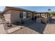 Charming backyard featuring low maintenance landscaping, patio, and beautiful desert views at 21730 N Black Bear Lodge Dr, Surprise, AZ 85387