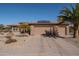 Charming home featuring desert landscaping, solar panels, and a three-car garage at 21730 N Black Bear Lodge Dr, Surprise, AZ 85387