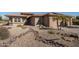Stunning home featuring desert landscaping, native plants and unique rock features at 21730 N Black Bear Lodge Dr, Surprise, AZ 85387