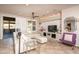 Bright living space with a large sectional sofa and seamless access to the dining area at 21730 N Black Bear Lodge Dr, Surprise, AZ 85387