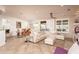 Bright living space with a large sectional sofa and seamless access to the dining area at 21730 N Black Bear Lodge Dr, Surprise, AZ 85387