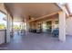 Spacious covered patio with comfortable seating and desert landscaping at 21730 N Black Bear Lodge Dr, Surprise, AZ 85387