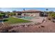 Backyard view of private pool, patio, and desert landscaping at 21730 N Black Bear Lodge Dr, Surprise, AZ 85387