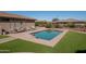 Sparkling backyard pool with surrounding patio and desert landscaping at 21730 N Black Bear Lodge Dr, Surprise, AZ 85387