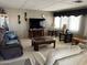 Inviting living room with comfortable seating and a large window providing ample natural light for a relaxed atmosphere at 2207 N Shannon Way, Mesa, AZ 85215