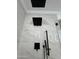 Modern shower with rainfall showerhead and black hardware at 2212 W Alicia Dr, Phoenix, AZ 85041