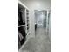 Open view from closet to bathroom including soaking tub, walk-in shower, and vanity at 2212 W Alicia Dr, Phoenix, AZ 85041