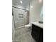 Modern bathroom features a glass enclosed shower and updated vanity at 2212 W Alicia Dr, Phoenix, AZ 85041