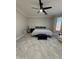 Comfortable bedroom with ceiling fan and tile floors at 2212 W Alicia Dr, Phoenix, AZ 85041
