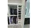 Walk-in closet with custom-built shelving and clothing organization at 2212 W Alicia Dr, Phoenix, AZ 85041
