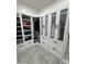 Spacious walk-in closet with custom shelving and wardrobe organization system at 2212 W Alicia Dr, Phoenix, AZ 85041