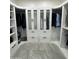 Custom walk-in closet with ample storage and well-organized layout at 2212 W Alicia Dr, Phoenix, AZ 85041