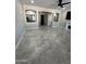 Open living room featuring tile floors, arches, and neutral decor at 2212 W Alicia Dr, Phoenix, AZ 85041
