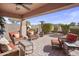 Relaxing covered patio featuring comfortable seating, perfect for outdoor entertaining and leisure at 22177 E Calle De Flores --, Queen Creek, AZ 85142