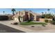 Charming two-story home with a three-car garage, desert landscaping, and a private lawn at 2332 S Brighton --, Mesa, AZ 85209