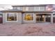 Back exterior view of a two-story home with large windows, showcasing natural light and modern design at 25297 N 163Rd Dr, Surprise, AZ 85387