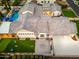 Aerial view of the home showcasing the putting green, pool, large patio and hardscape at 2656 E Oriole Dr, Gilbert, AZ 85297
