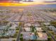 Stunning aerial view of a Primary-planned community featuring beautiful homes with private pools at sunset at 2656 E Oriole Dr, Gilbert, AZ 85297