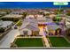 Areal view showcasing the home's sprawling layout, casita, lush landscaping and hardscape at 2656 E Oriole Dr, Gilbert, AZ 85297