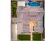 An aerial view of the backyard that highlights the pool, putting green, and outdoor lounge area at 2656 E Oriole Dr, Gilbert, AZ 85297